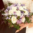 roses, gentian, limonium, lisiantus ,leather fern leaves 